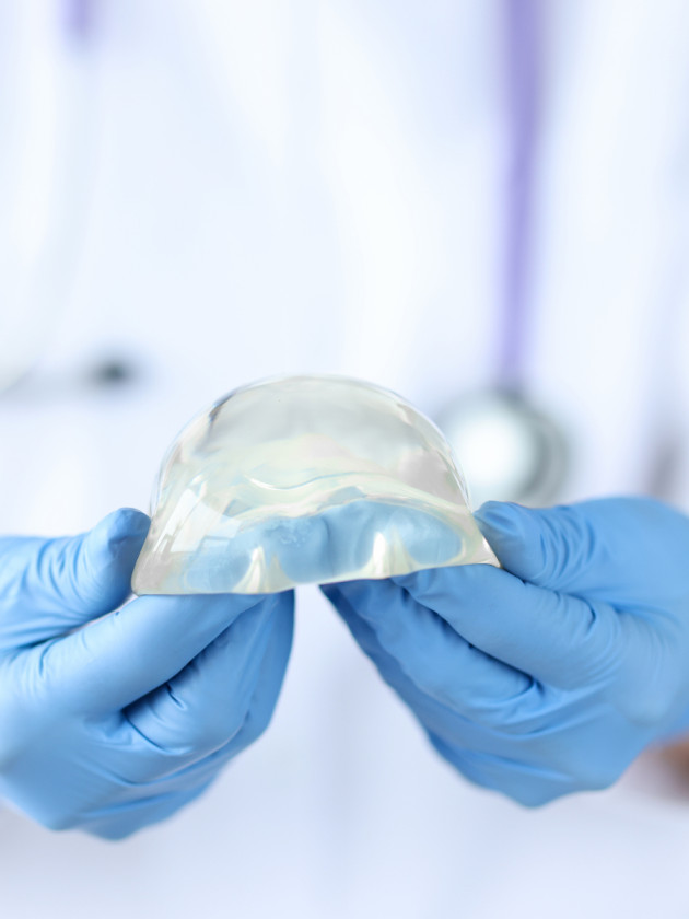 Doctor Holding a Silicon Breast Implant - Boise Plastic Surgery and Hand Center