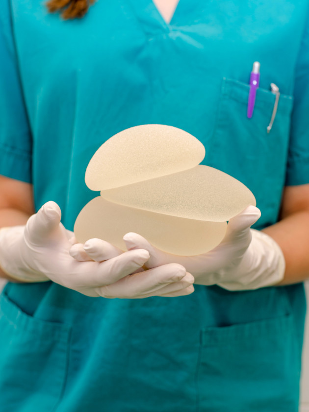 Doctor Holding a Silicon Breast Implant - Boise Plastic Surgery and Hand Center